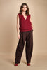 gilet over links