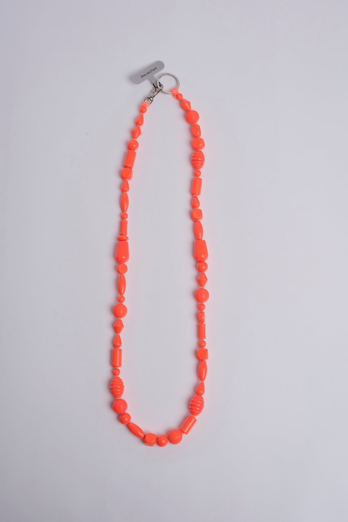 Porta telefono perline PHONENECKLACE NEONORANGE ina.seifart 