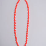 Porta telefono perline rotondo PHONENECKLACE BIG NEONORANGE ina.seifart 