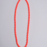 Porta telefono perline rotondo PHONENECKLACE BIG NEONORANGE ina.seifart 