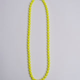 Porta telefono perline rotondo PHONENECKLACE BIG NEONYELLOW ina.seifart 