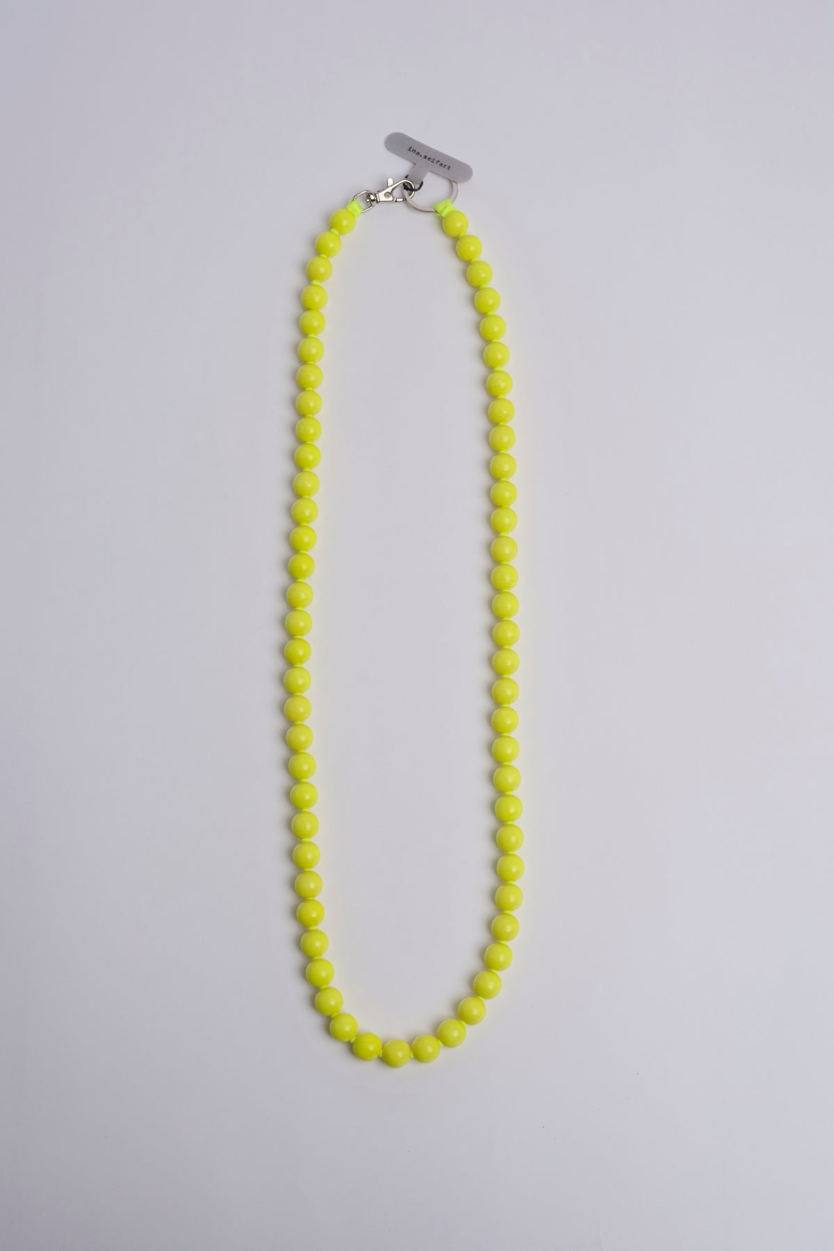 Porta telefono perline rotondo PHONENECKLACE BIG NEONYELLOW ina.seifart 