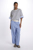 Pleated trousers with white belt