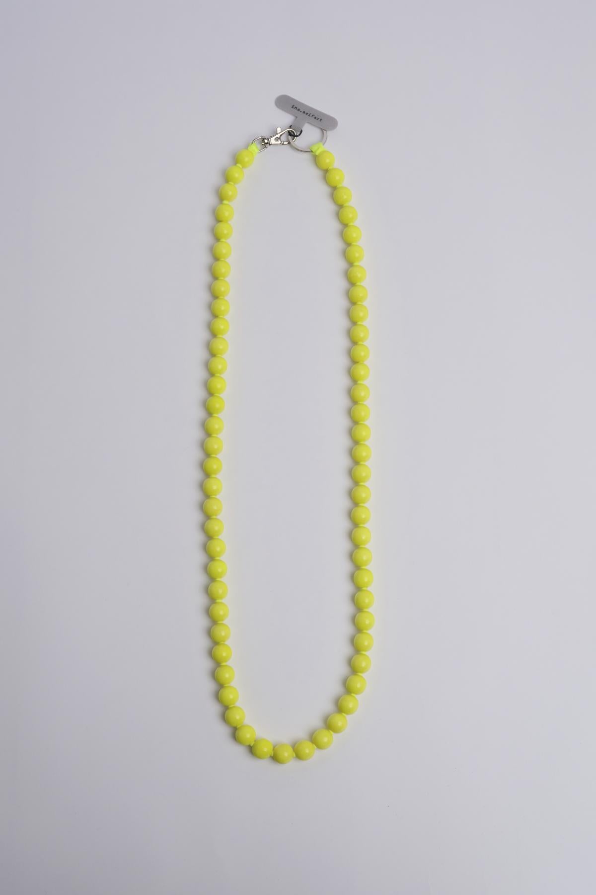 Porta telefono perline rotondo PHONENECKLACE BIG NEONYELLOW ina.seifart 