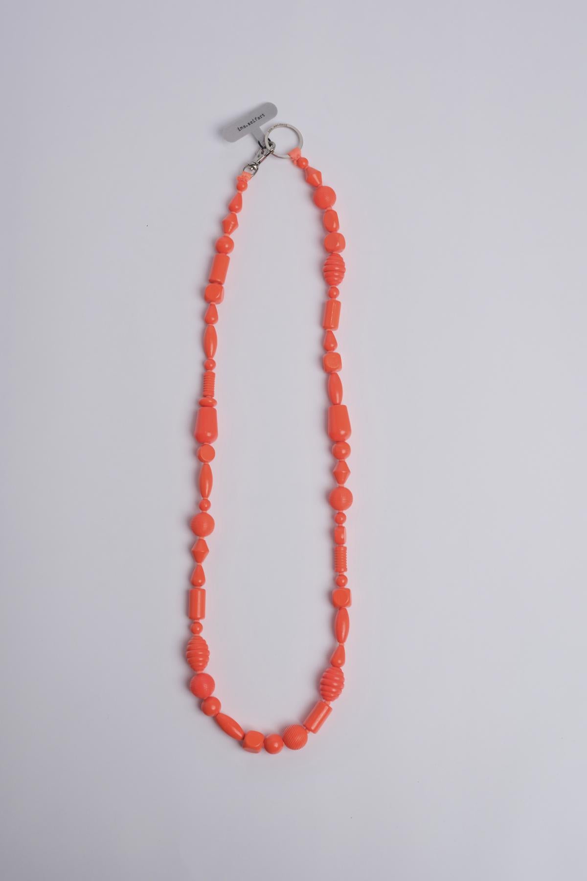 Porta telefono perline PHONENECKLACE NEONORANGE ina.seifart 