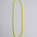 Porta telefono perline rotondo PHONENECKLACE BIG NEONYELLOW ina.seifart 