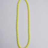 Porta telefono perline rotondo PHONENECKLACE BIG NEONYELLOW ina.seifart 