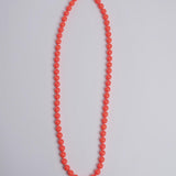 Porta telefono perline rotondo PHONENECKLACE BIG NEONORANGE ina.seifart 